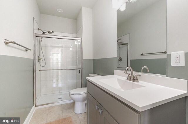 814 N Patterson Park Ave, Baltimore, MD 21205 - full bathroom with toilet, a stall shower, vanity, and tile patterned floors