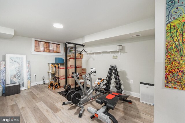 814 N Patterson Park Ave, Baltimore, MD 21205 - exercise area with wood finished floors and baseboards