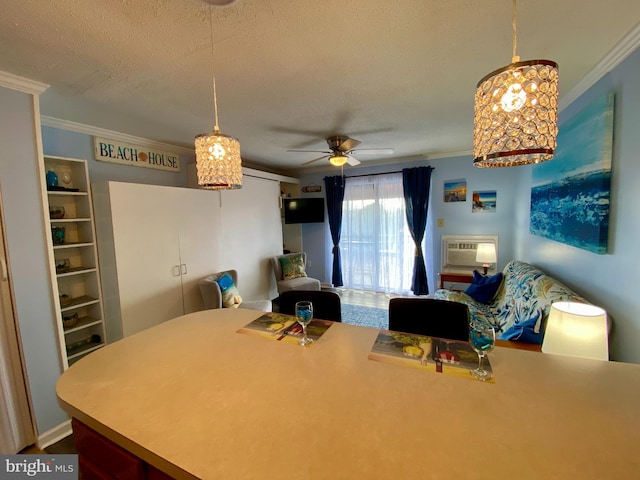 202 32nd St Unit 309, Ocean City, MD 21842 - office area with ornamental molding, a ceiling fan, a textured ceiling, and a wall mounted air conditioner
