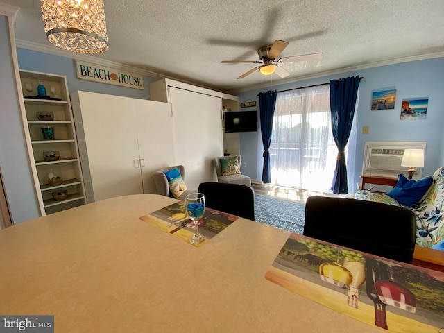 202 32nd St Unit 309, Ocean City, MD 21842 - dining space with crown molding, a textured ceiling, ceiling fan, a chandelier, and a wall mounted air conditioner
