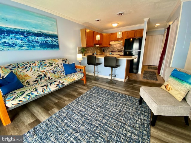 202 32nd St Unit 309, Ocean City, MD 21842 - living room featuring ornamental molding and dark wood-style flooring