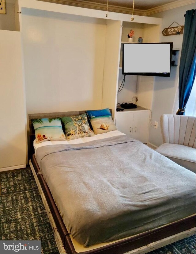 202 32nd St Unit 309, Ocean City, MD 21842 - carpeted bedroom featuring ornamental molding and baseboards