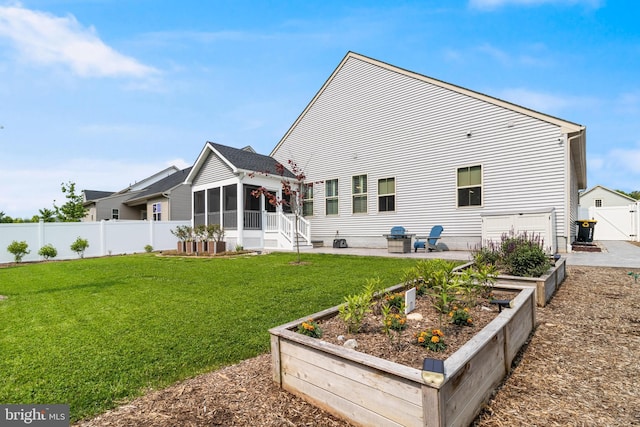 10104 Dressage Dr, Upper Marlboro, MD 20772 - rear view of house with a sunroom and a garden