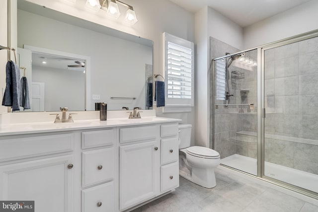 10104 Dressage Dr, Upper Marlboro, MD 20772 - full bathroom with double vanity, toilet, a stall shower, tile patterned floors, and a ceiling fan