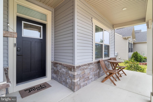 10104 Dressage Dr, Upper Marlboro, MD 20772 - doorway to property with covered porch and stone siding