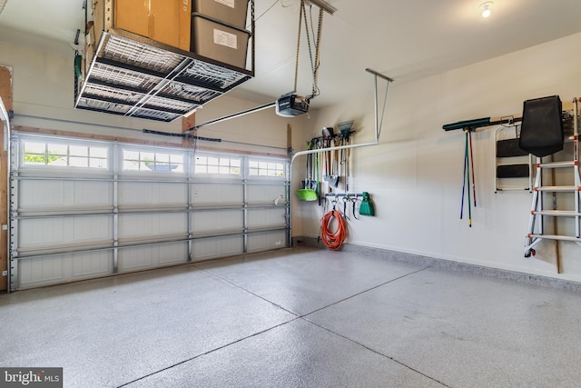 10104 Dressage Dr, Upper Marlboro, MD 20772 - garage with a garage door opener and baseboards