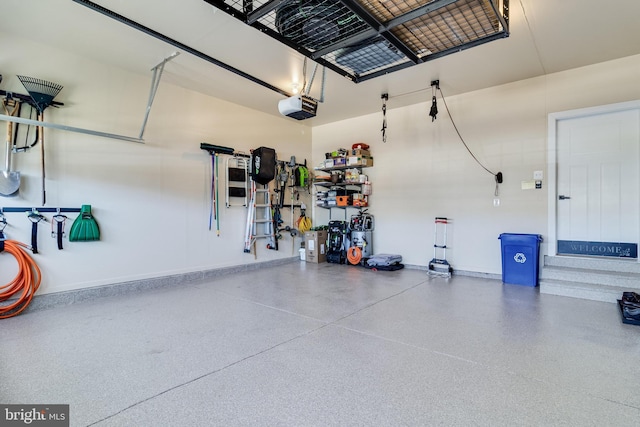 10104 Dressage Dr, Upper Marlboro, MD 20772 - garage with a garage door opener and baseboards