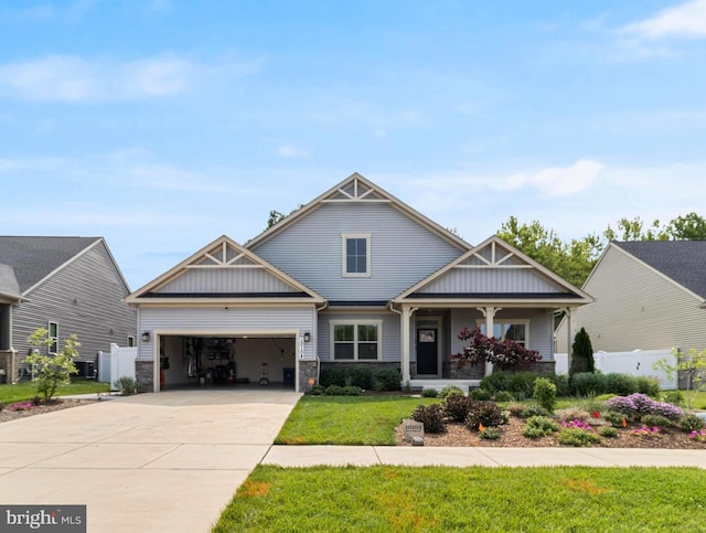 10104 Dressage Dr, Upper Marlboro, MD 20772 - craftsman house with a garage, driveway, a porch, stone siding, and board and batten siding