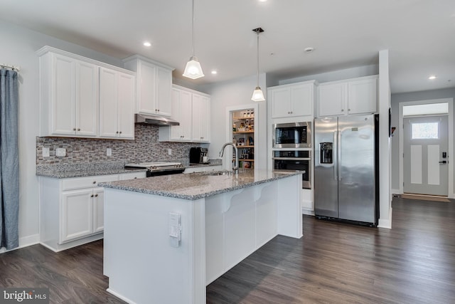 10104 Dressage Dr, Upper Marlboro, MD 20772 - kitchen with stainless steel appliances, a sink, dark wood-type flooring, tasteful backsplash, and under cabinet range hood