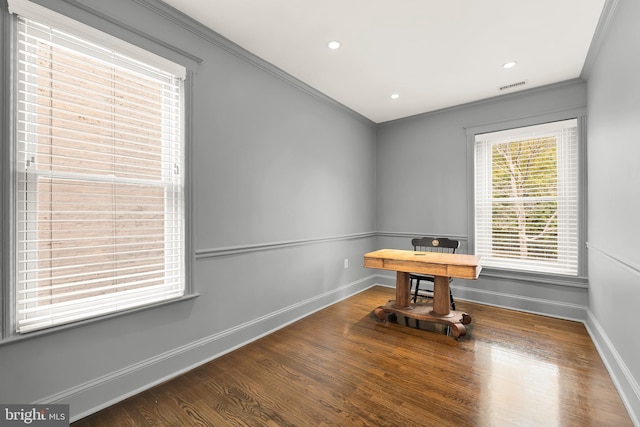 unfurnished office featuring ornamental molding, baseboards, wood finished floors, and recessed lighting