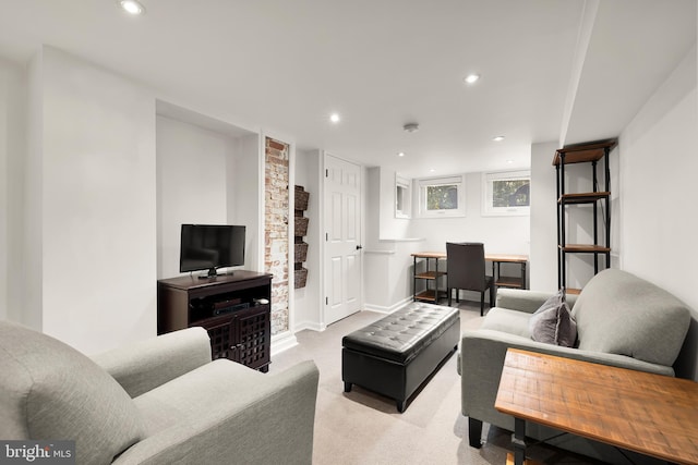 living room with light colored carpet, recessed lighting, and baseboards