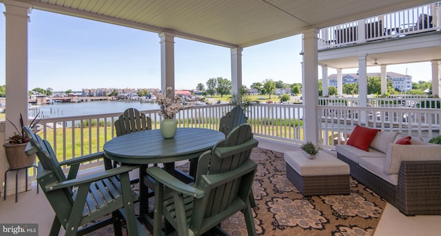 301 Muir St Unit 201, Cambridge, MD 21613 - view of patio with a water view and outdoor dining area