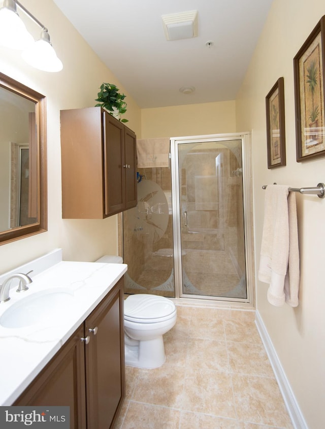 301 Muir St Unit 201, Cambridge, MD 21613 - bathroom with vanity, toilet, a shower stall, tile patterned flooring, and baseboards