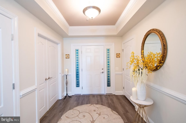 301 Muir St Unit 201, Cambridge, MD 21613 - foyer entrance with dark wood-type flooring, a tray ceiling, and ornamental molding