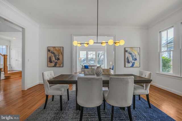 5127 Cathedral Ave NW, Washington, DC 20016 - dining area with wood finished floors, plenty of natural light, baseboards, and ornamental molding