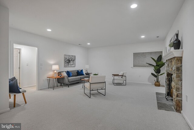 5127 Cathedral Ave NW, Washington, DC 20016 - carpeted living area with recessed lighting, baseboards, and a stone fireplace