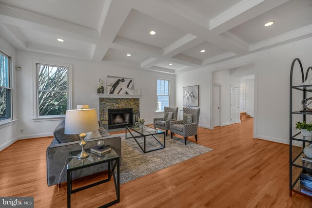 5127 Cathedral Ave NW, Washington, DC 20016 - living area with coffered ceiling, a fireplace, beam ceiling, baseboards, and light wood-type flooring