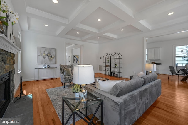 5127 Cathedral Ave NW, Washington, DC 20016 - living room featuring a fireplace, coffered ceiling, beamed ceiling, wood finished floors, and baseboards