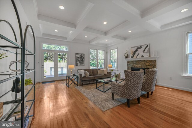 5127 Cathedral Ave NW, Washington, DC 20016 - living area featuring wood finished floors, coffered ceiling, beamed ceiling, baseboards, and a fireplace