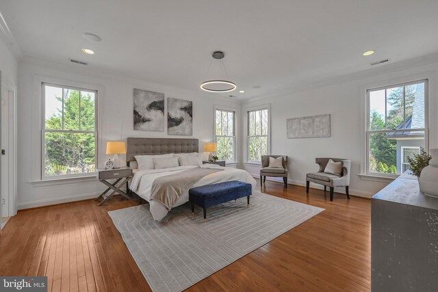 5127 Cathedral Ave NW, Washington, DC 20016 - bedroom with crown molding, hardwood / wood-style floors, baseboards, and recessed lighting