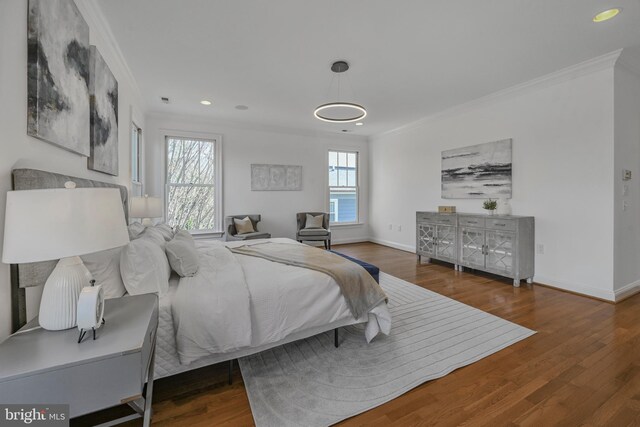 5127 Cathedral Ave NW, Washington, DC 20016 - bedroom with crown molding, wood finished floors, baseboards, and recessed lighting