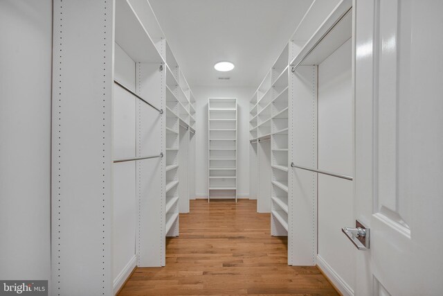 5127 Cathedral Ave NW, Washington, DC 20016 - walk in closet featuring light wood-style floors