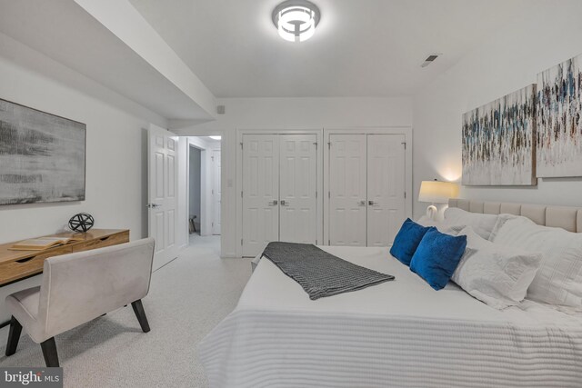 5127 Cathedral Ave NW, Washington, DC 20016 - carpeted bedroom featuring two closets