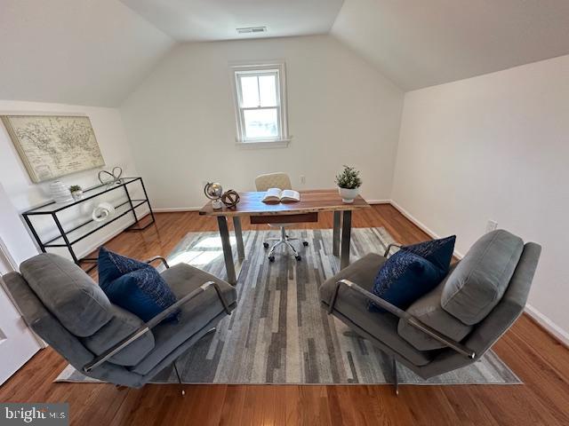 5127 Cathedral Ave NW, Washington, DC 20016 - office featuring vaulted ceiling, baseboards, and wood finished floors