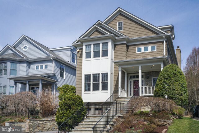 5127 Cathedral Ave NW, Washington, DC 20016 - view of front of home featuring stairway and covered porch