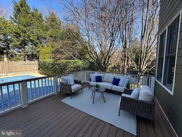 5127 Cathedral Ave NW, Washington, DC 20016 - wooden deck with an outdoor living space and a fenced backyard