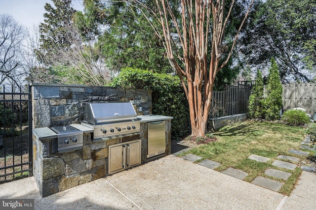 5127 Cathedral Ave NW, Washington, DC 20016 - fenced backyard with a patio area