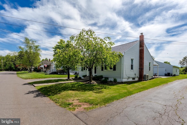 46 Jefferson St, Weatherly, PA 18255 - view of front facade with cooling unit, a front lawn, and a chimney
