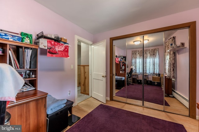 46 Jefferson St, Weatherly, PA 18255 - bedroom featuring baseboard heating, wood finished floors, and a closet