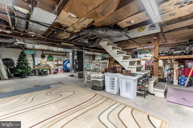 46 Jefferson St, Weatherly, PA 18255 - unfinished basement featuring stairway, heating unit, and washer / clothes dryer
