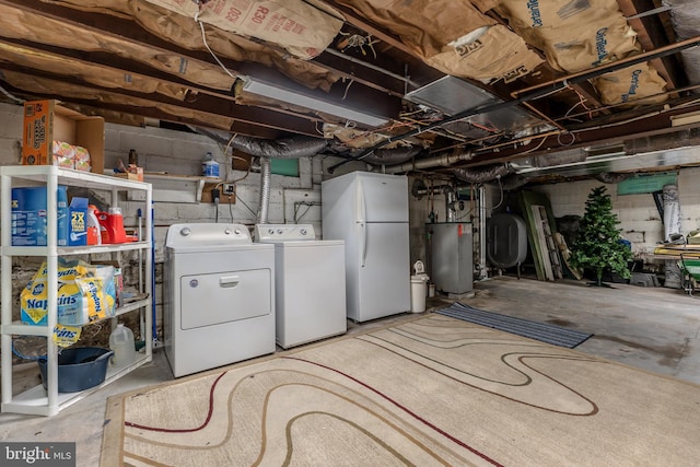 46 Jefferson St, Weatherly, PA 18255 - unfinished below grade area featuring gas water heater, separate washer and dryer, freestanding refrigerator, and oil tank