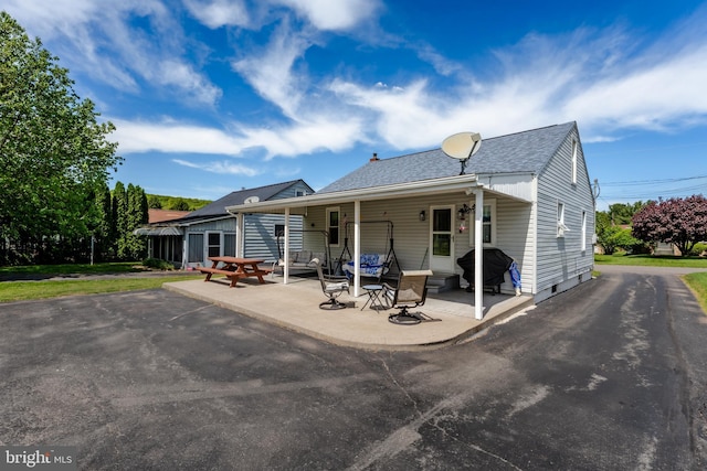 46 Jefferson St, Weatherly, PA 18255 - back of property featuring a patio area and roof with shingles