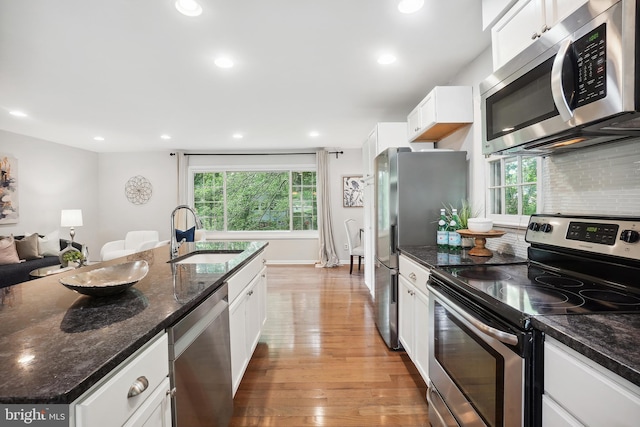 900 W Nolcrest Dr, Silver Spring, MD 20903 - kitchen with appliances with stainless steel finishes, a sink, white cabinetry, recessed lighting, and light wood-style flooring