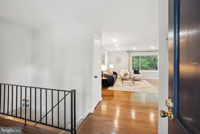 900 W Nolcrest Dr, Silver Spring, MD 20903 - corridor with an upstairs landing, wood-type flooring, recessed lighting, and baseboards