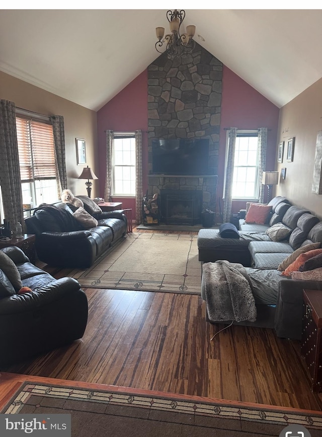 131 Winding Way, Bangor, PA 18013 - living area featuring wood finished floors, plenty of natural light, a stone fireplace, and high vaulted ceiling