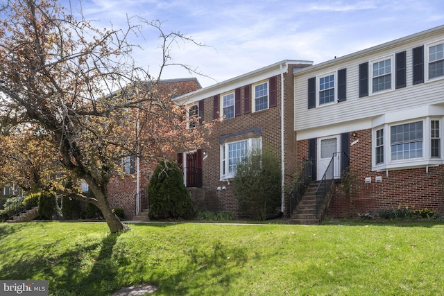 941 Sherwood Ct, Sterling, VA 20164 - view of front of house featuring a front yard and brick siding