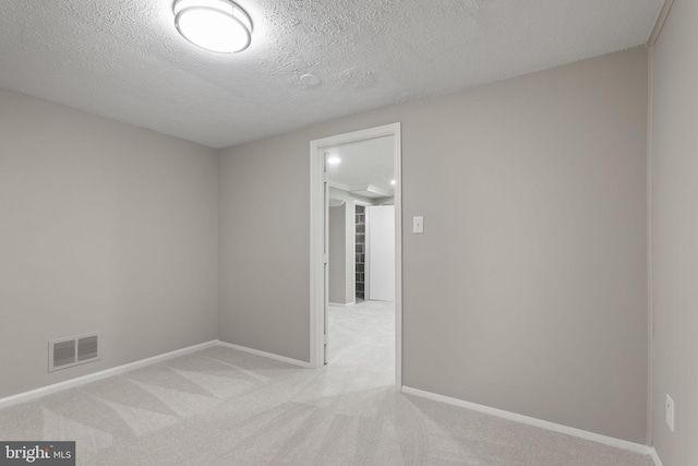 941 Sherwood Ct, Sterling, VA 20164 - empty room with light carpet, baseboards, and a textured ceiling