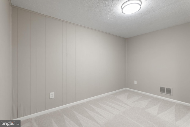941 Sherwood Ct, Sterling, VA 20164 - spare room with a textured ceiling, carpet floors, and baseboards