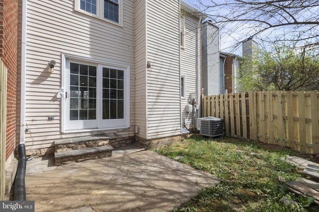 941 Sherwood Ct, Sterling, VA 20164 - view of home's exterior with fence, entry steps, central air condition unit, and a patio