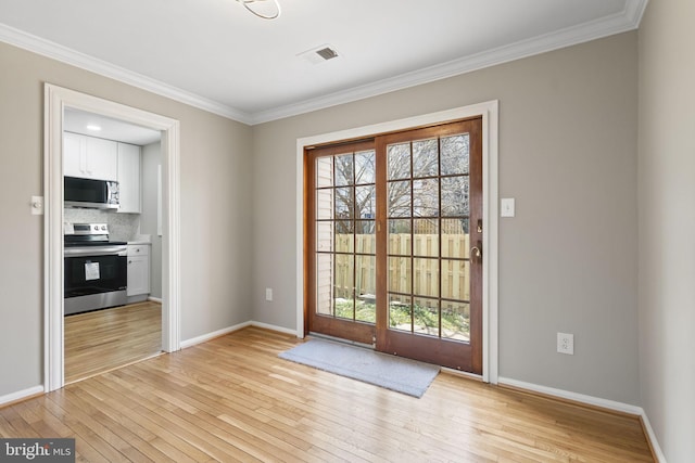 941 Sherwood Ct, Sterling, VA 20164 - doorway with light wood-type flooring, baseboards, and ornamental molding
