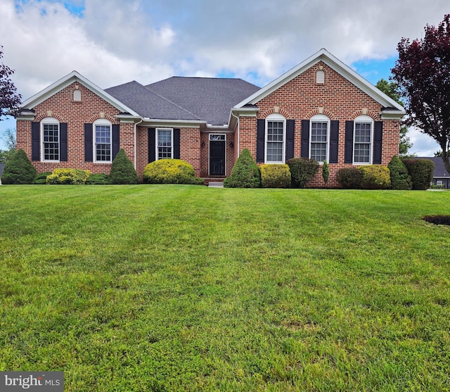 7677 Green Ridge Ln, Abbottstown, PA 17301 - view of front of property featuring brick siding, a front yard, and a shingled roof