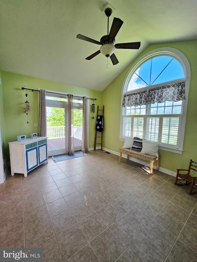 7677 Green Ridge Ln, Abbottstown, PA 17301 - unfurnished room featuring lofted ceiling, dark tile patterned flooring, a ceiling fan, and baseboards