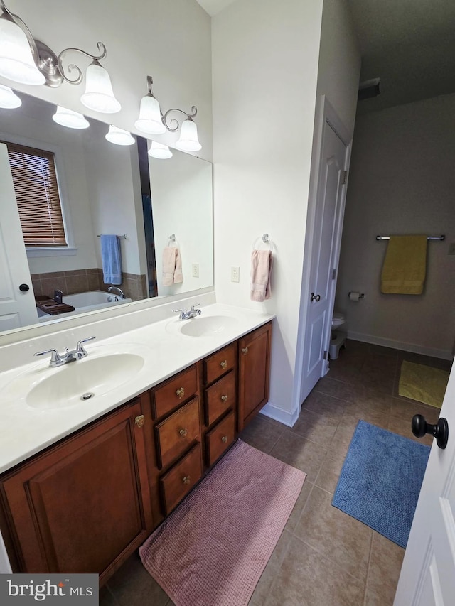 7677 Green Ridge Ln, Abbottstown, PA 17301 - bathroom with double vanity, tile patterned flooring, and a garden tub