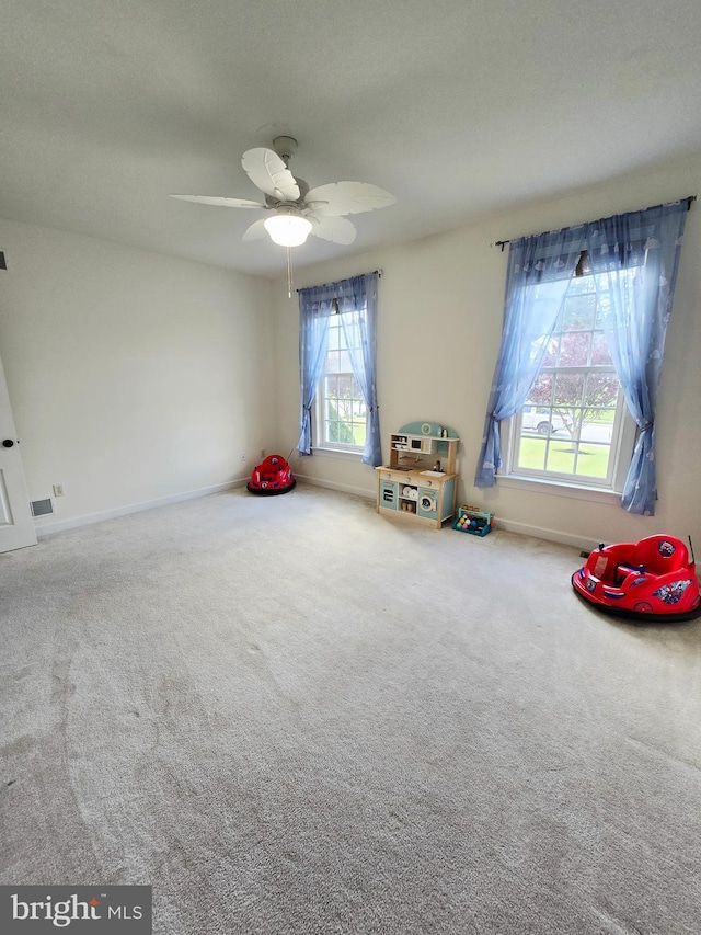 7677 Green Ridge Ln, Abbottstown, PA 17301 - recreation room featuring healthy amount of natural light, carpet, baseboards, and ceiling fan