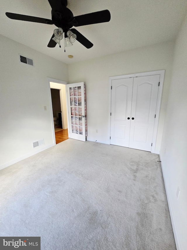 7677 Green Ridge Ln, Abbottstown, PA 17301 - unfurnished bedroom featuring carpet, a closet, baseboards, and a ceiling fan