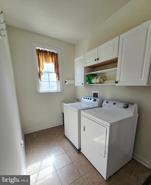 7677 Green Ridge Ln, Abbottstown, PA 17301 - laundry room with cabinet space, independent washer and dryer, light tile patterned flooring, and baseboards